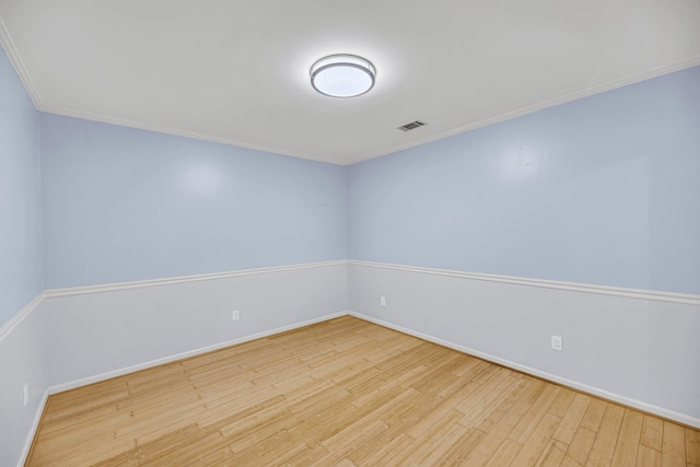1309 Llewellyn Rd, Mount Pleasant, SC 29464 - spare room with wood finished floors, crown molding, and baseboards