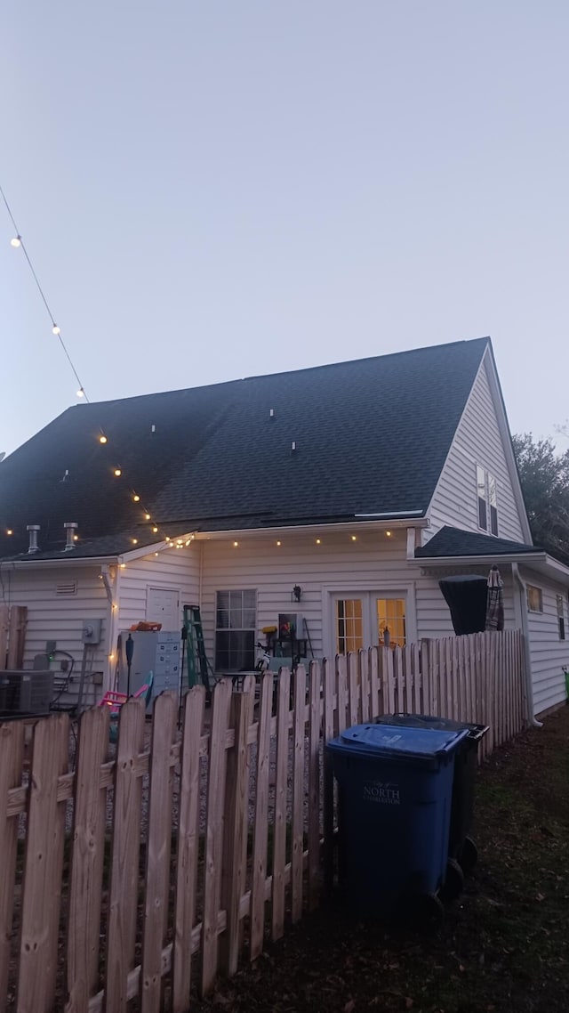 view of back house at dusk