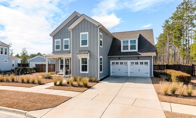 view of front facade with fence, board and batten siding, driveway, and a shingled roof