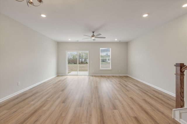 interior space with light wood-type flooring, ceiling fan, baseboards, and recessed lighting