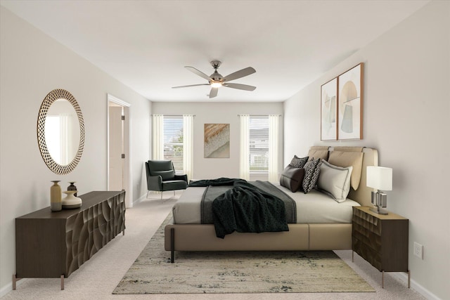 bedroom featuring baseboards, a ceiling fan, and light colored carpet