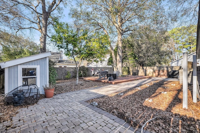 view of yard with a fenced backyard and a deck