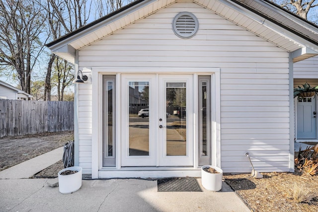 exterior space with fence and french doors