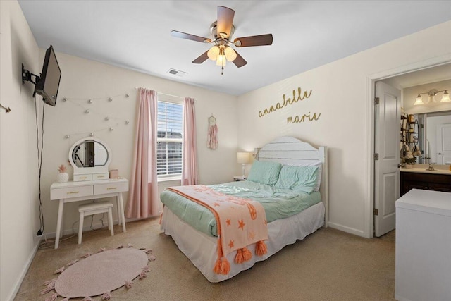 carpeted bedroom with a ceiling fan, visible vents, and baseboards