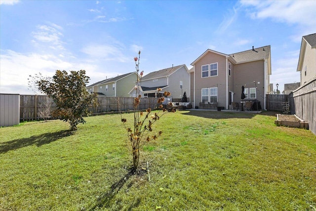 view of yard featuring a fenced backyard