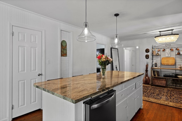 kitchen featuring crown molding, hanging light fixtures, white cabinets, dark wood-style flooring, and a kitchen island