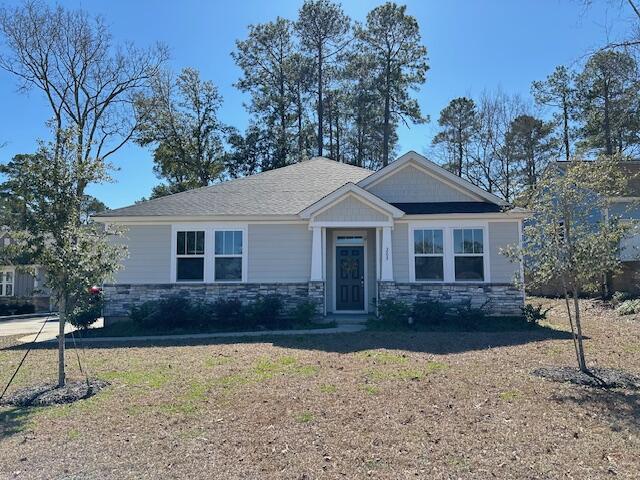 205 Myrtlewood Dr, Santee, SC 29142 - craftsman-style house with stone siding and a front yard