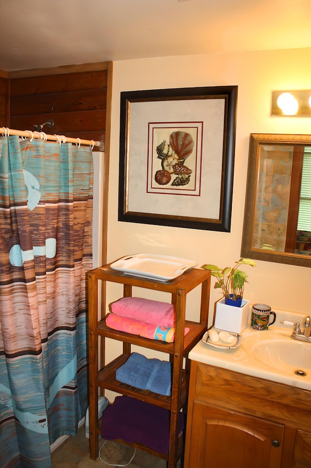 bathroom with tile patterned flooring and vanity