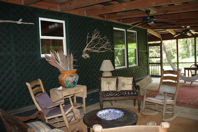 sunroom / solarium with ceiling fan