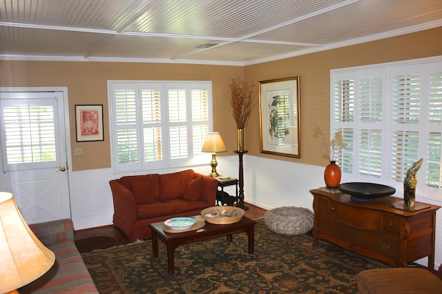 living room featuring hardwood / wood-style flooring and crown molding