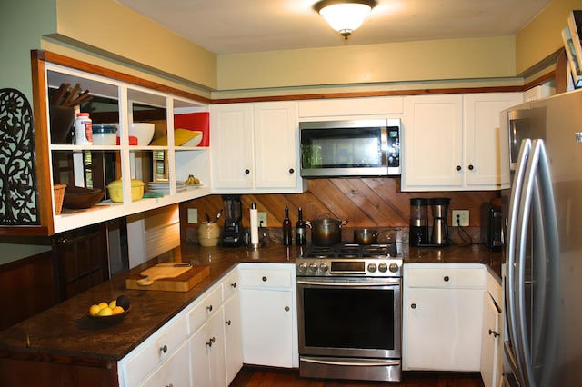 kitchen with appliances with stainless steel finishes and white cabinetry