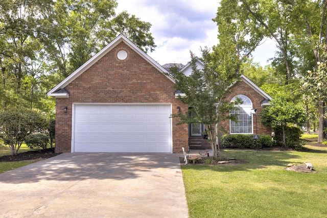 256 Ridge Lake Dr, Manning, SC 29102 - view of front of house featuring brick siding, concrete driveway, and a front yard