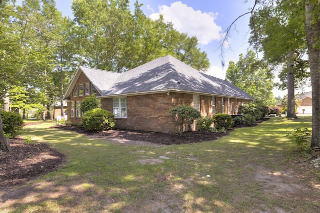 256 Ridge Lake Dr, Manning, SC 29102 - view of home's exterior featuring brick siding, a yard, and roof with shingles