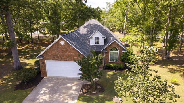 256 Ridge Lake Dr, Manning, SC 29102 - traditional home with brick siding, driveway, an attached garage, and roof with shingles