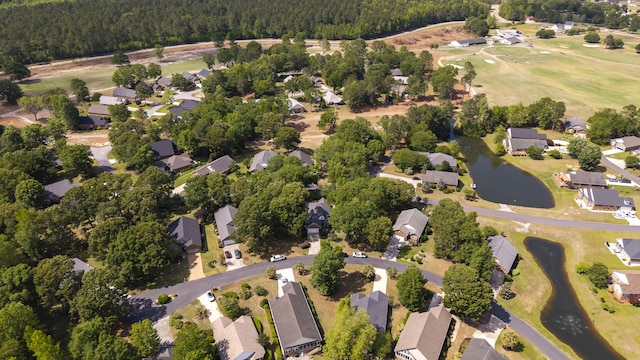 256 Ridge Lake Dr, Manning, SC 29102 - aerial view of property and surrounding area with nearby suburban area, a forest, a local golf course, and a nearby body of water