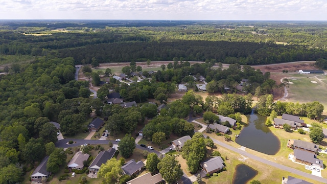 256 Ridge Lake Dr, Manning, SC 29102 - aerial view of property and surrounding area with a heavily wooded area, nearby suburban area, and a nearby body of water