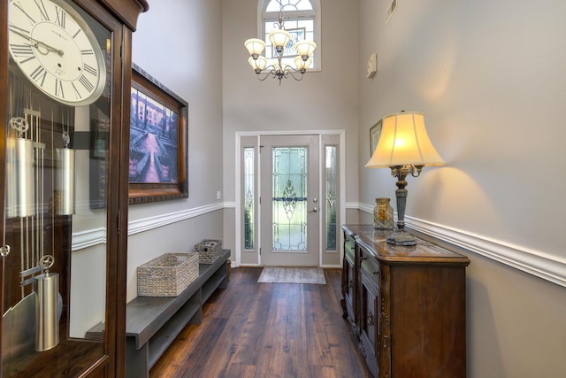 256 Ridge Lake Dr, Manning, SC 29102 - foyer with healthy amount of natural light, a chandelier, dark wood-type flooring, and a towering ceiling