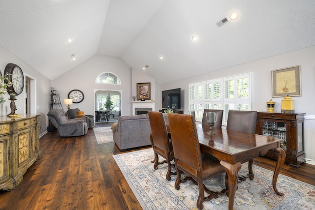 256 Ridge Lake Dr, Manning, SC 29102 - dining space with a fireplace, dark wood finished floors, and high vaulted ceiling