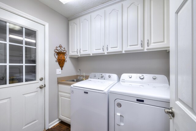 256 Ridge Lake Dr, Manning, SC 29102 - laundry room featuring washer and clothes dryer, cabinet space, a textured ceiling, and dark wood-style floors