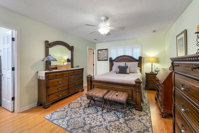 256 Ridge Lake Dr, Manning, SC 29102 - bedroom featuring light wood-type flooring, a textured ceiling, a ceiling fan, and baseboards