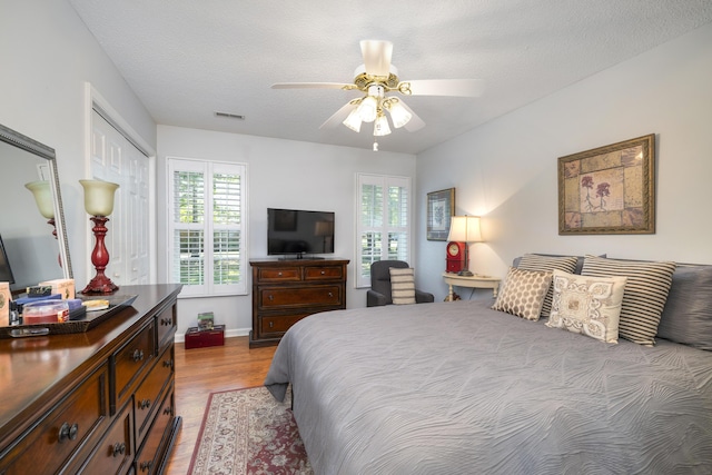 256 Ridge Lake Dr, Manning, SC 29102 - bedroom featuring wood finished floors, ceiling fan, a closet, and baseboards