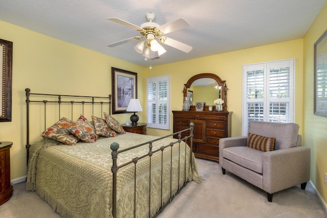256 Ridge Lake Dr, Manning, SC 29102 - bedroom featuring light carpet, a ceiling fan, and a textured ceiling