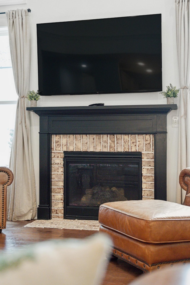 233 Camber Rd, Huger, SC 29450 - detailed view of a brick fireplace and wood finished floors