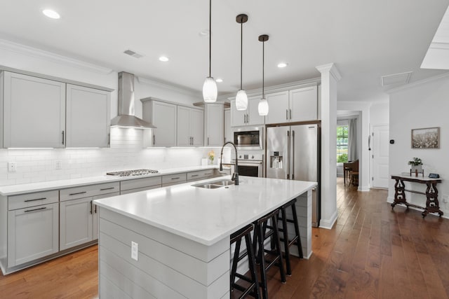 233 Camber Rd, Huger, SC 29450 - kitchen featuring wall chimney exhaust hood, stainless steel appliances, ornamental molding, backsplash, and a breakfast bar area
