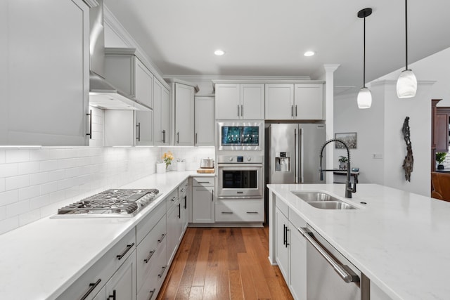 233 Camber Rd, Huger, SC 29450 - kitchen with stainless steel appliances, wall chimney exhaust hood, decorative backsplash, pendant lighting, and dark wood-style flooring