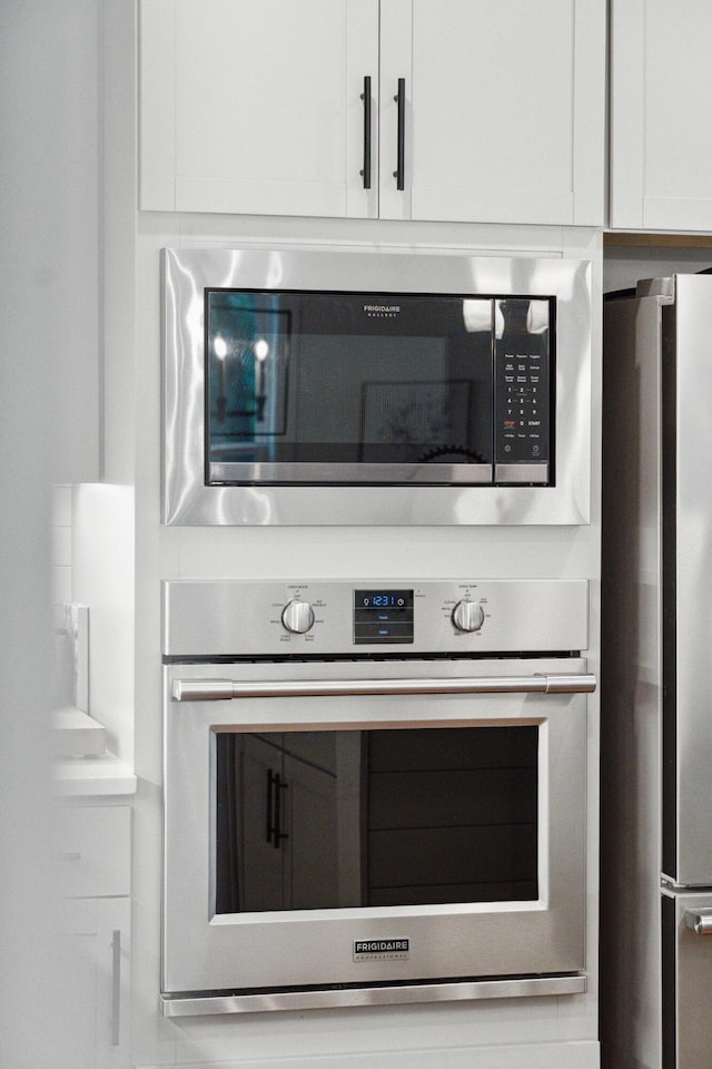 233 Camber Rd, Huger, SC 29450 - kitchen view of stainless steel appliances and white cabinetry