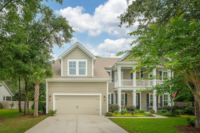 233 Camber Rd, Huger, SC 29450 - view of front of home featuring concrete driveway, a balcony, a garage, and roof with shingles