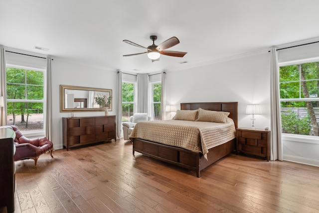 233 Camber Rd, Huger, SC 29450 - bedroom featuring hardwood / wood-style flooring, multiple windows, ornamental molding, and ceiling fan