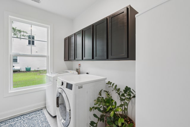 233 Camber Rd, Huger, SC 29450 - laundry room featuring washer and clothes dryer, plenty of natural light, and cabinet space