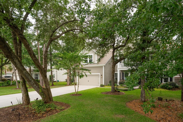 233 Camber Rd, Huger, SC 29450 - obstructed view of property featuring concrete driveway, an attached garage, and a front yard