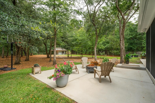 233 Camber Rd, Huger, SC 29450 - view of patio / terrace with a fire pit, an outbuilding, and view of scattered trees