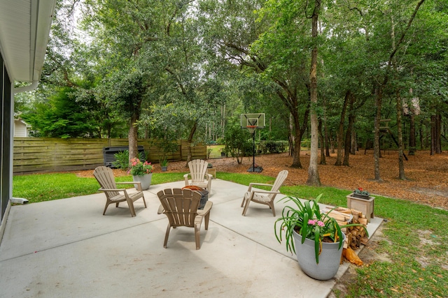 233 Camber Rd, Huger, SC 29450 - view of patio featuring a fire pit and view of wooded area