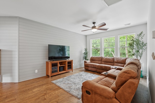 233 Camber Rd, Huger, SC 29450 - living area featuring a ceiling fan, wood finished floors, and wooden walls