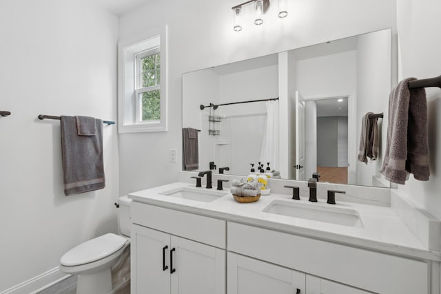 233 Camber Rd, Huger, SC 29450 - bathroom featuring double vanity and a shower with shower curtain