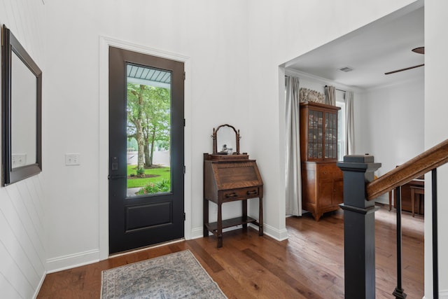 233 Camber Rd, Huger, SC 29450 - entrance foyer with wood finished floors, stairs, a ceiling fan, and crown molding
