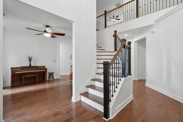 233 Camber Rd, Huger, SC 29450 - staircase featuring a ceiling fan and wood-type flooring