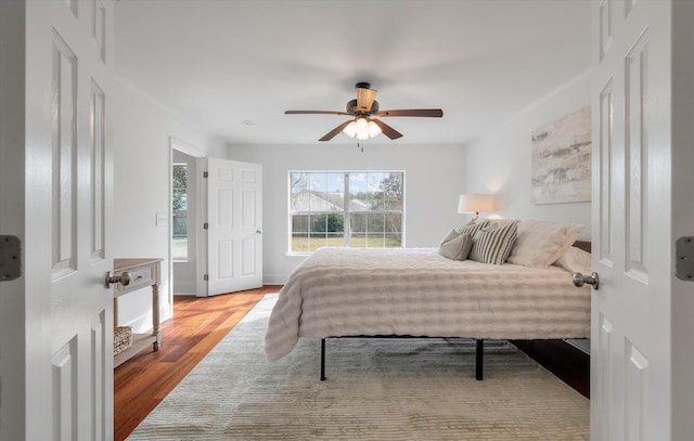 bedroom featuring ceiling fan and light hardwood / wood-style floors