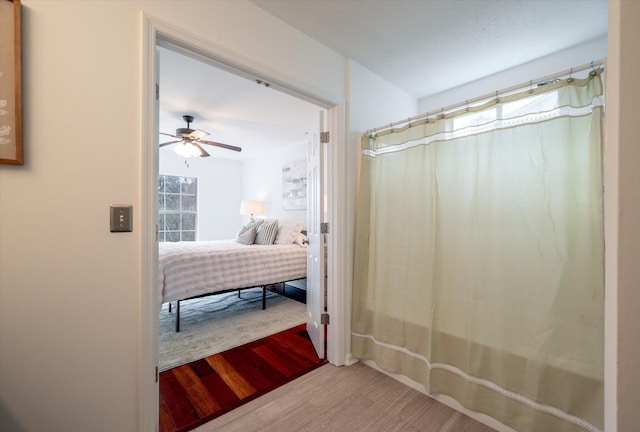 bathroom featuring ceiling fan and hardwood / wood-style flooring