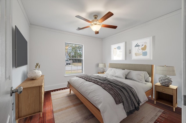 bedroom with ceiling fan, crown molding, and dark wood-type flooring