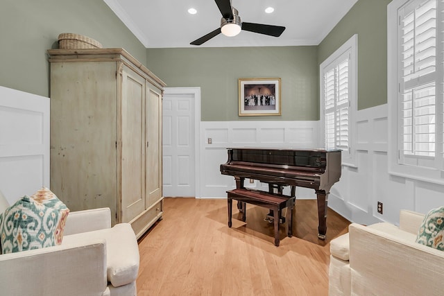 7021 Schooner St, Charleston, SC 29492 - living area with ceiling fan, light wood-style flooring, recessed lighting, a wainscoted wall, and healthy amount of natural light