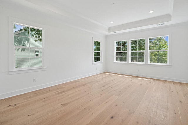 2027 Riverbend Dr, James Island, SC 29412 - empty room with a raised ceiling, light wood-style floors, and recessed lighting