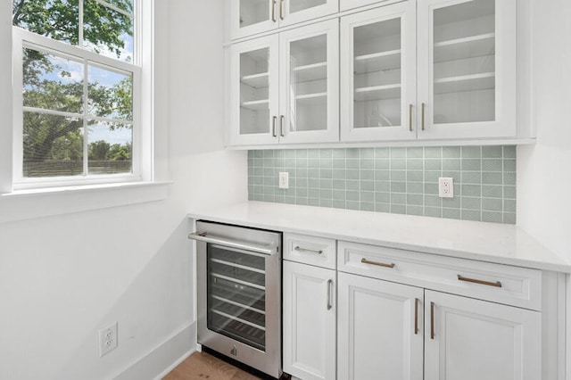 2027 Riverbend Dr, James Island, SC 29412 - bar featuring wine cooler and backsplash