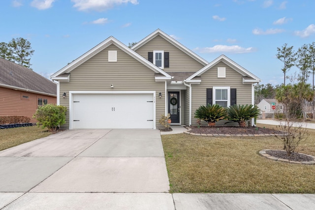 view of front of home featuring a garage and a front lawn