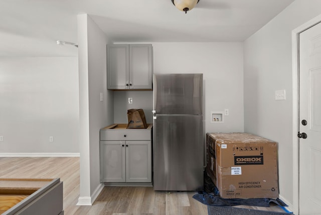3113 Matipan Ave, North Charleston, SC 29405 - kitchen featuring freestanding refrigerator, light wood finished floors, and gray cabinetry