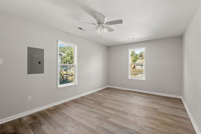 3113 Matipan Ave, North Charleston, SC 29405 - spare room featuring electric panel, plenty of natural light, a ceiling fan, and light wood-style flooring