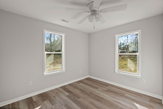 3113 Matipan Ave, North Charleston, SC 29405 - spare room with plenty of natural light, wood finished floors, and ceiling fan